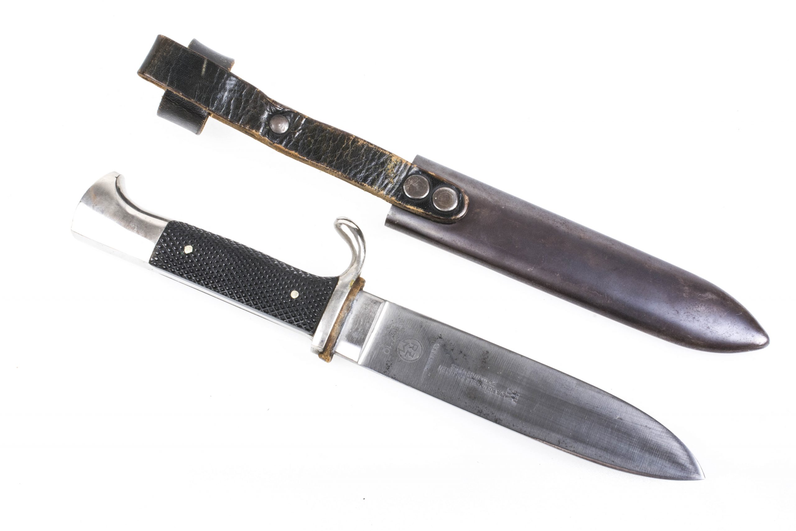 A dagger M 37 for Hitler Youth leaders, with hanger. Maker M7/36, E & F  Hörster, Solingen. Plated blade, the obverse side etched with the motto  Blut und Ehre! (Blood and Honour!).